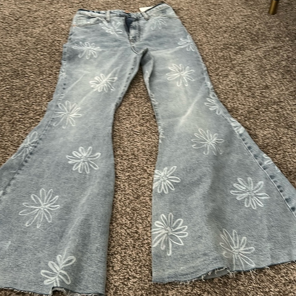 New never worn flowered flare jeans